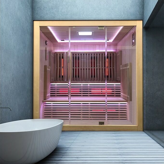 Sauna infrarouge à spectre complet Boreal Concept, modèle moderne en bois clair avec éclairage LED multicolore intégré, installé dans une salle de bain design.
