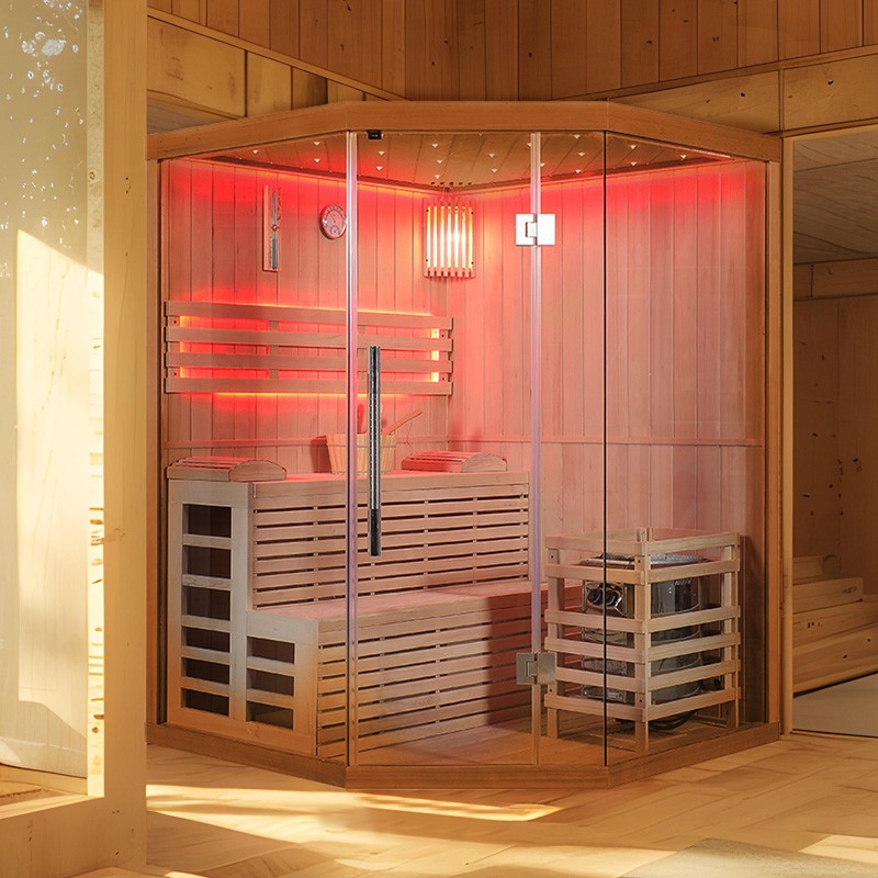 Sauna finlandais d’angle Nordica, conçu en bois naturel avec éclairage LED rouge, équipé d’un poêle à vapeur traditionnel.